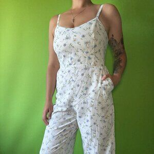 7/8 length linen jumpsuit with floral design, adjustable straps, elastic